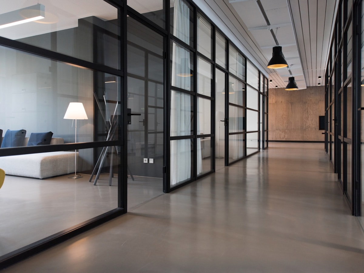 Modern law-office interior with a boardroom table and bookshelves at Ashraf & Associates in Lahore