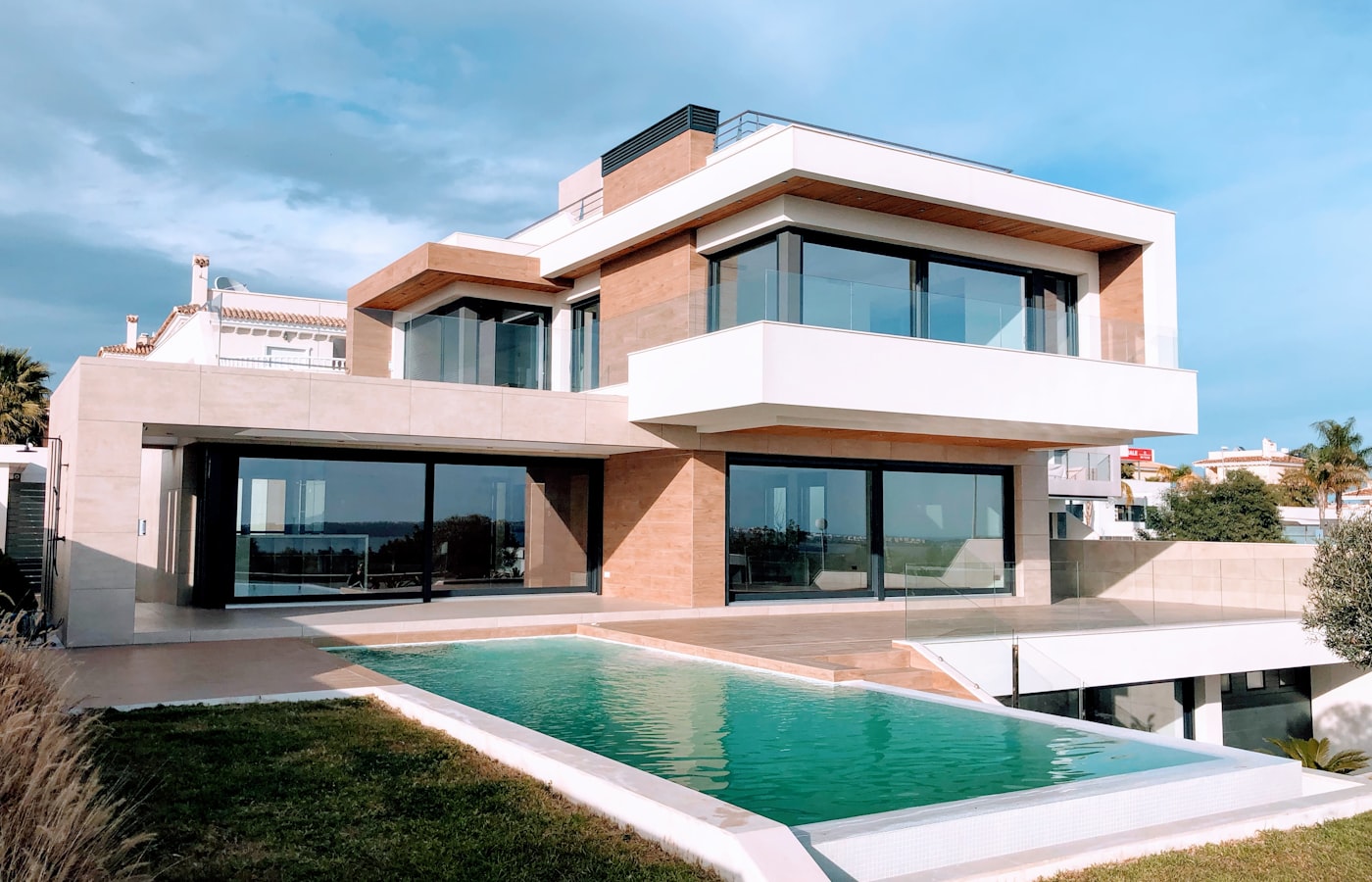 Modern luxury villa with a swimming pool in Lahore at dusk