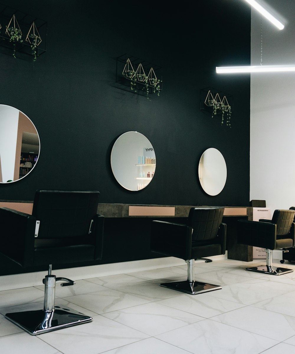 Interior of the Lumière salon studio in Lahore with warm lighting and elegant styling stations