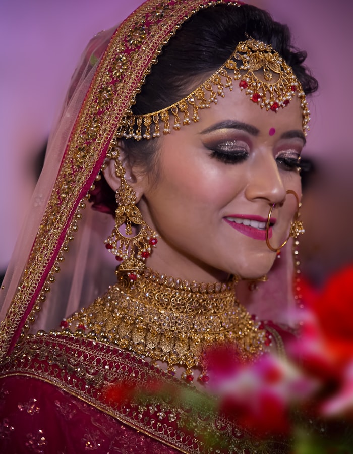 South Asian bride in traditional jewellery and bridal makeup by Lumière