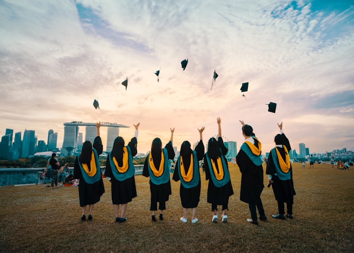 Group of graduates celebrating scholarships and degrees earned at universities abroad